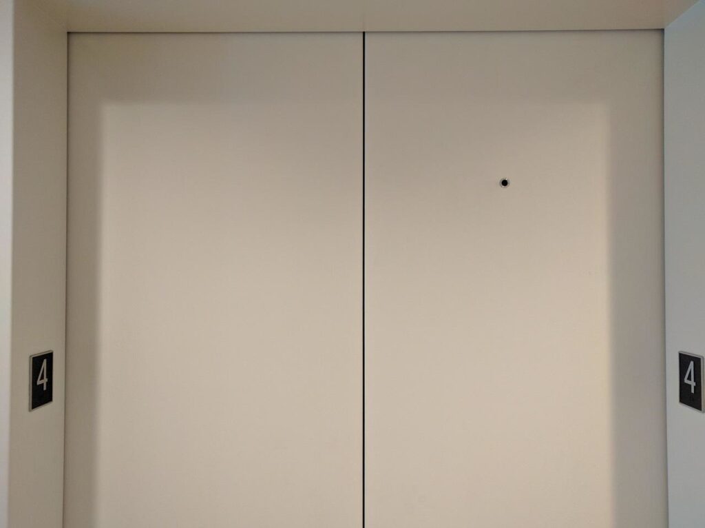 That Tiny Hole On Elevator Doors