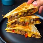 Dive into the flavors of this family-loved Loaded Steak Quesadillas recipe. Perfect for any gathering, it's a cheesy, meaty delight that's easy to make!