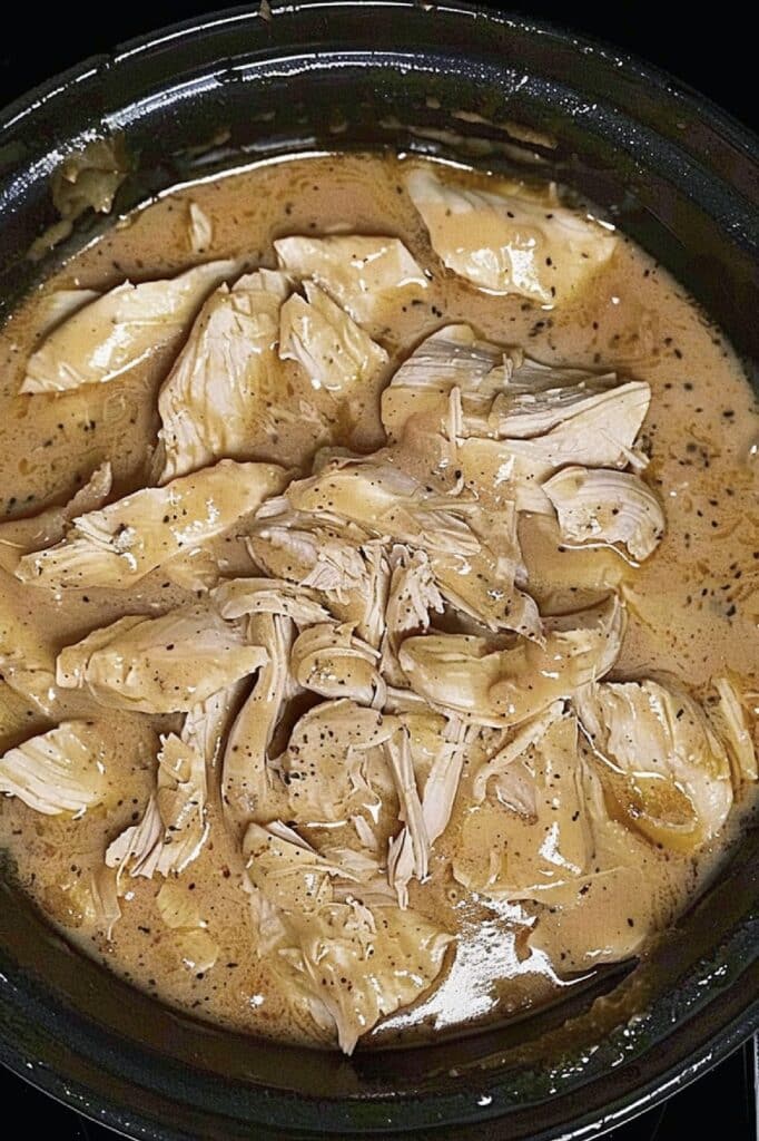 Satisfy your comfort food cravings with this easy-to-make and flavorful Crockpot Chicken with Gravy recipe.