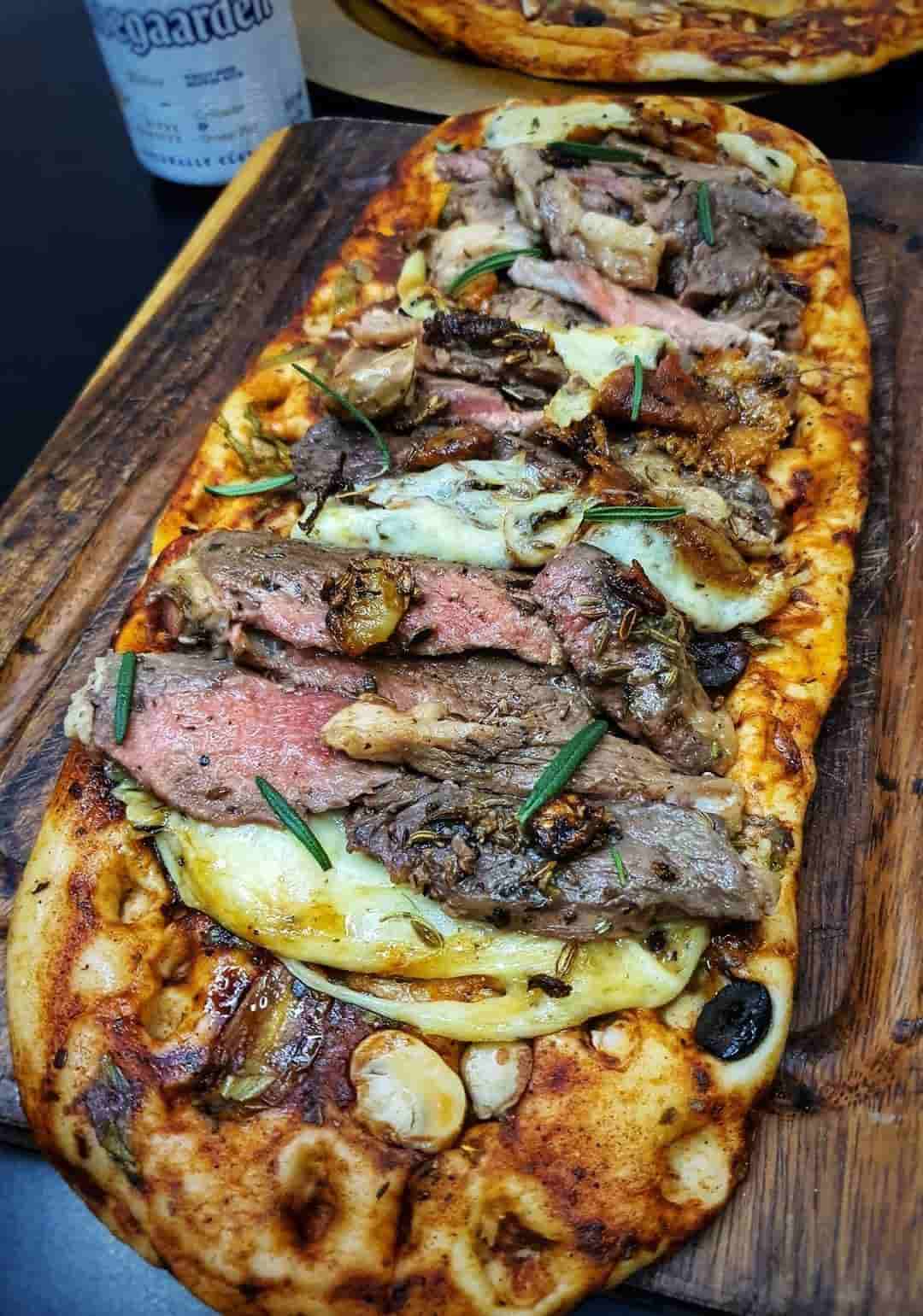 Steak & Sun-dried tomato,olives and mozzarella flat bread