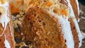 Carrot Cake with Cream Cheese Frosting topped with Walnuts