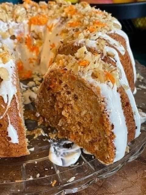 Carrot Cake with Cream Cheese Frosting topped with Walnuts