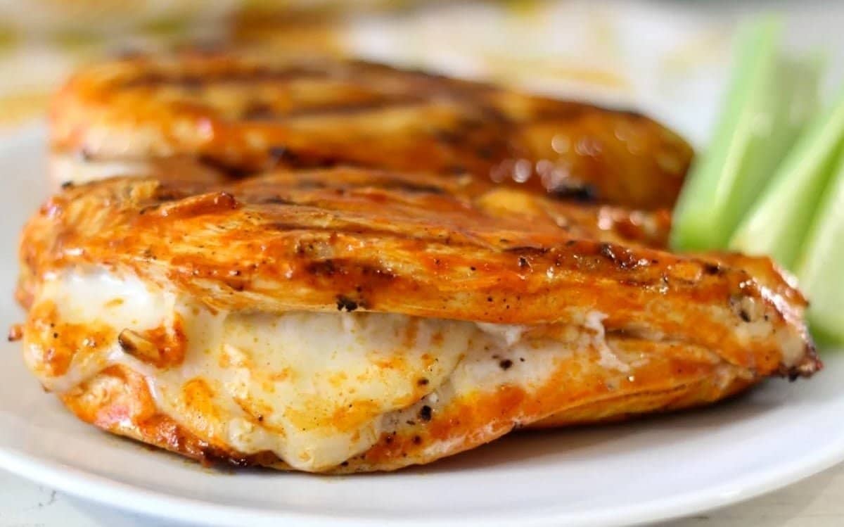 Grilled buffalo chicken stuffed with mozzarella cheese