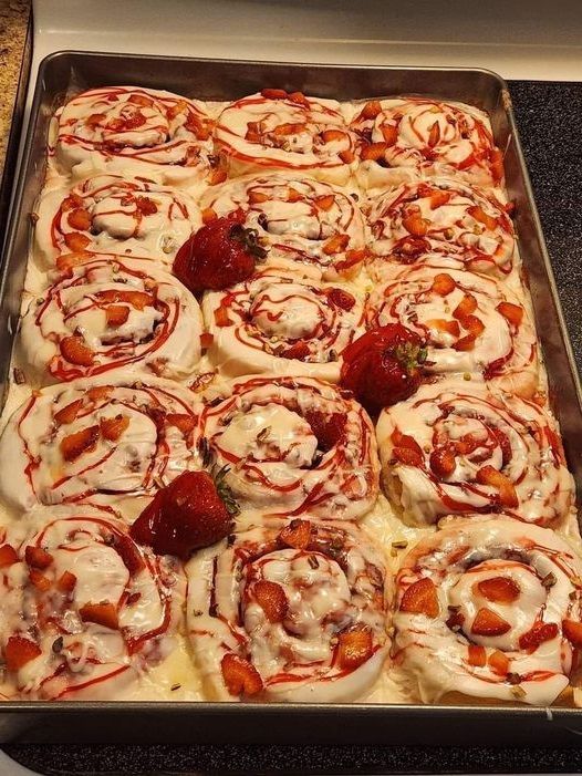 Strawberry Cheesecake Cinnabon Rolls with a dazzle of pecans