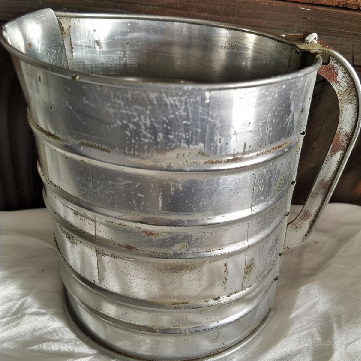 8 Vintage Cooking Tools Disappearing From Modern Kitchens: A Culinary Nostalgia Journey 8 Traditional flour sifter in action